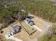 Aerial view of the property showing the layout of the homes and proximity to the road at 8007 Wishaw Ct, Winston, GA 30187
