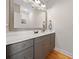Bathroom with a large mirror, gray cabinets and white countertop at 8007 Wishaw Ct, Winston, GA 30187