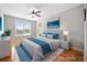 Bright bedroom with neutral walls, natural light and comfortable furnishings at 8007 Wishaw Ct, Winston, GA 30187