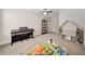 Cozy ' room features carpeted floors, ample space for play, and a ceiling fan for comfort at 8007 Wishaw Ct, Winston, GA 30187