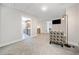 Bonus room with neutral walls, carpeted floors and an accent chair at 8007 Wishaw Ct, Winston, GA 30187