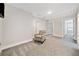 Cozy bonus room with carpeted floors and an accent chair at 8007 Wishaw Ct, Winston, GA 30187