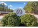 The Saint Andrews Golf Club features beautiful landscaping at the neighborhood entrance at 8007 Wishaw Ct, Winston, GA 30187