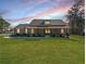 Charming single-story home with a well-manicured lawn and inviting covered front porch at 8007 Wishaw Ct, Winston, GA 30187
