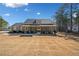 Charming one story home with a large front yard, covered porch, and mature trees at 8007 Wishaw Ct, Winston, GA 30187