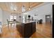 Spacious kitchen with island, wood ceiling and connecting living area at 8007 Wishaw Ct, Winston, GA 30187