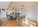 Charming kitchen with white cabinets, wooden ceiling and center island with seating at 8007 Wishaw Ct, Winston, GA 30187