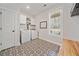Neat laundry room featuring a patterned tile floor and storage cabinets at 8007 Wishaw Ct, Winston, GA 30187