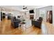 Open-concept living room with hardwood floors and fireplace at 8007 Wishaw Ct, Winston, GA 30187