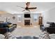 Bright living room featuring fireplace, wood floors, and comfortable seating at 8007 Wishaw Ct, Winston, GA 30187