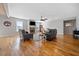 Spacious living room with fireplace, wood floors, and cozy seating at 8007 Wishaw Ct, Winston, GA 30187