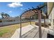 Backyard patio featuring an outdoor pergola-covered seating area and a luxurious hot tub for relaxation at 8007 Wishaw Ct, Winston, GA 30187