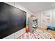 Charming playroom with chalkboard, toys, and colorful rug at 8007 Wishaw Ct, Winston, GA 30187
