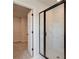 Modern bathroom featuring a glass shower with a black frame at 178 Haverling Pass, Hampton, GA 30228