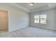Light-filled bedroom with large window and connecting closet at 178 Haverling Pass, Hampton, GA 30228