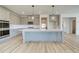 Well-equipped kitchen with a center island, stainless steel appliances, and stylish cabinetry at 178 Haverling Pass, Hampton, GA 30228