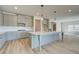 Modern kitchen with a center island, stainless steel appliances, and ample cabinet space at 178 Haverling Pass, Hampton, GA 30228
