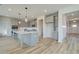 Modern kitchen featuring a large island, stainless steel appliances, and sleek countertops at 178 Haverling Pass, Hampton, GA 30228