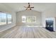 Bright living room with vaulted ceilings, a fireplace, and large windows offering ample natural light at 178 Haverling Pass, Hampton, GA 30228