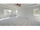 Spacious main bedroom featuring a tray ceiling and ample natural light at 178 Haverling Pass, Hampton, GA 30228