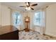 Bedroom featuring an easel, hardwood floors, ceiling fan and neutral colored walls at 2230 Peachtree Ne Rd # A-3, Atlanta, GA 30309