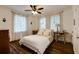Bedroom featuring hardwood floors, ceiling fan, and natural light from large windows at 2230 Peachtree Ne Rd # A-3, Atlanta, GA 30309