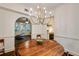 Cozy dining room with hardwood floors and modern lighting, open to a living room and kitchen at 2230 Peachtree Ne Rd # A-3, Atlanta, GA 30309