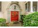 Close-up of the home's entrance featuring a red door with diamond-patterned glass and classic architecture at 2230 Peachtree Ne Rd # A-3, Atlanta, GA 30309