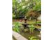 A serene community garden features a stone fountain, benches, and lush landscaping at 2230 Peachtree Ne Rd # A-3, Atlanta, GA 30309