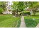 A serene community garden features a stone fountain, benches, and lush landscaping at 2230 Peachtree Ne Rd # A-3, Atlanta, GA 30309