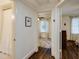 Hallway view to bathroom and bedroom with hardwood flooring and neutral colored walls at 2230 Peachtree Ne Rd # A-3, Atlanta, GA 30309