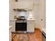 This is a kitchen featuring stainless steel appliances, white cabinets, neutral countertops and tiled backsplash at 2230 Peachtree Ne Rd # A-3, Atlanta, GA 30309