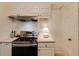 Efficient kitchen features stainless steel appliances, white cabinets, neutral countertops and tiled backsplash at 2230 Peachtree Ne Rd # A-3, Atlanta, GA 30309