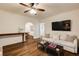 Inviting living room with hardwood floors, a comfortable white sofa, and an archway to the dining room at 2230 Peachtree Ne Rd # A-3, Atlanta, GA 30309