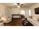 Bright living room with hardwood floors, comfortable seating, and an archway to the dining room at 2230 Peachtree Ne Rd # A-3, Atlanta, GA 30309