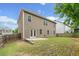 Private backyard with a patio, grassy area, and wooden fence at 3805 Alden Pl, Cumming, GA 30028