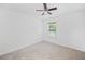 Bedroom with a neutral carpet floor, ceiling fan, and a window at 3805 Alden Pl, Cumming, GA 30028