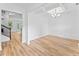 Elegant dining room with coffered ceilings, hardwood floors, and wainscoting at 3805 Alden Pl, Cumming, GA 30028