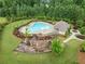 Aerial of community pool, playground, and surrounding landscaped common areas at 3805 Alden Pl, Cumming, GA 30028