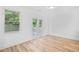 Bright and airy room with new wood floors and access to the outside through glass paneled french doors at 3805 Alden Pl, Cumming, GA 30028