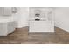 Clean kitchen features white cabinetry, an island with seating, and modern appliances for a sleek design at 3949 Fairhaven Rd, Lithia Springs, GA 30122
