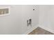 Bright laundry room offers connections for a washing machine and dryer at 3949 Fairhaven Rd, Lithia Springs, GA 30122