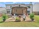 Backyard with outdoor seating surrounding a fire pit at 565 Barsham Way, Johns Creek, GA 30097