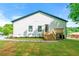 Spacious backyard features a well-maintained lawn, wooden deck, and stylish landscaping for outdoor living at 6054 Heritage Se Way, Mableton, GA 30126