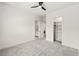 Neutral bedroom featuring a large closet and a partial view of the ensuite bath at 6054 Heritage Se Way, Mableton, GA 30126