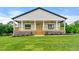 Charming home featuring a lovely covered porch with wooden accents and a brick foundation at 6054 Heritage Se Way, Mableton, GA 30126