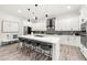 Modern kitchen featuring white cabinets, quartz counters, large island and stainless steel appliances at 6054 Heritage Se Way, Mableton, GA 30126