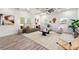 Bright living room with neutral tones, stylish decor, and large windows offering ample natural light at 6054 Heritage Se Way, Mableton, GA 30126