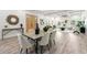 Sunlit open-concept living space featuring dining area and living room with modern decor at 6054 Heritage Se Way, Mableton, GA 30126