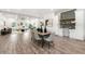 Open-concept living space with dining area, wet bar and living room bathed in natural light at 6054 Heritage Se Way, Mableton, GA 30126